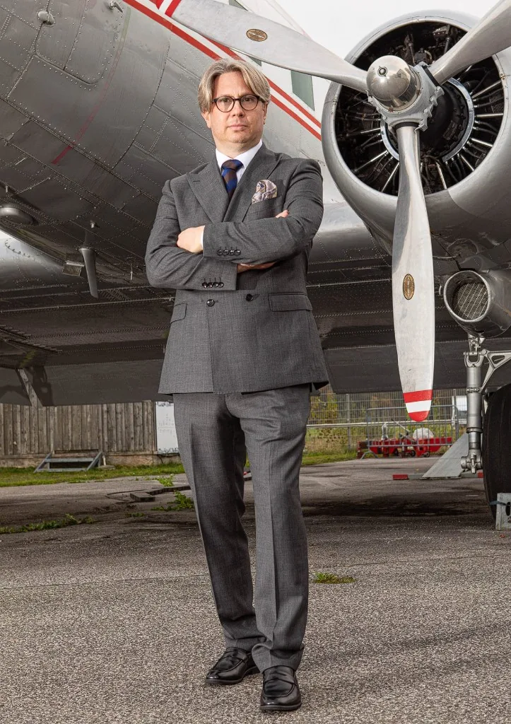 Dr. Thomas M. Friesacher in front of an aircraft